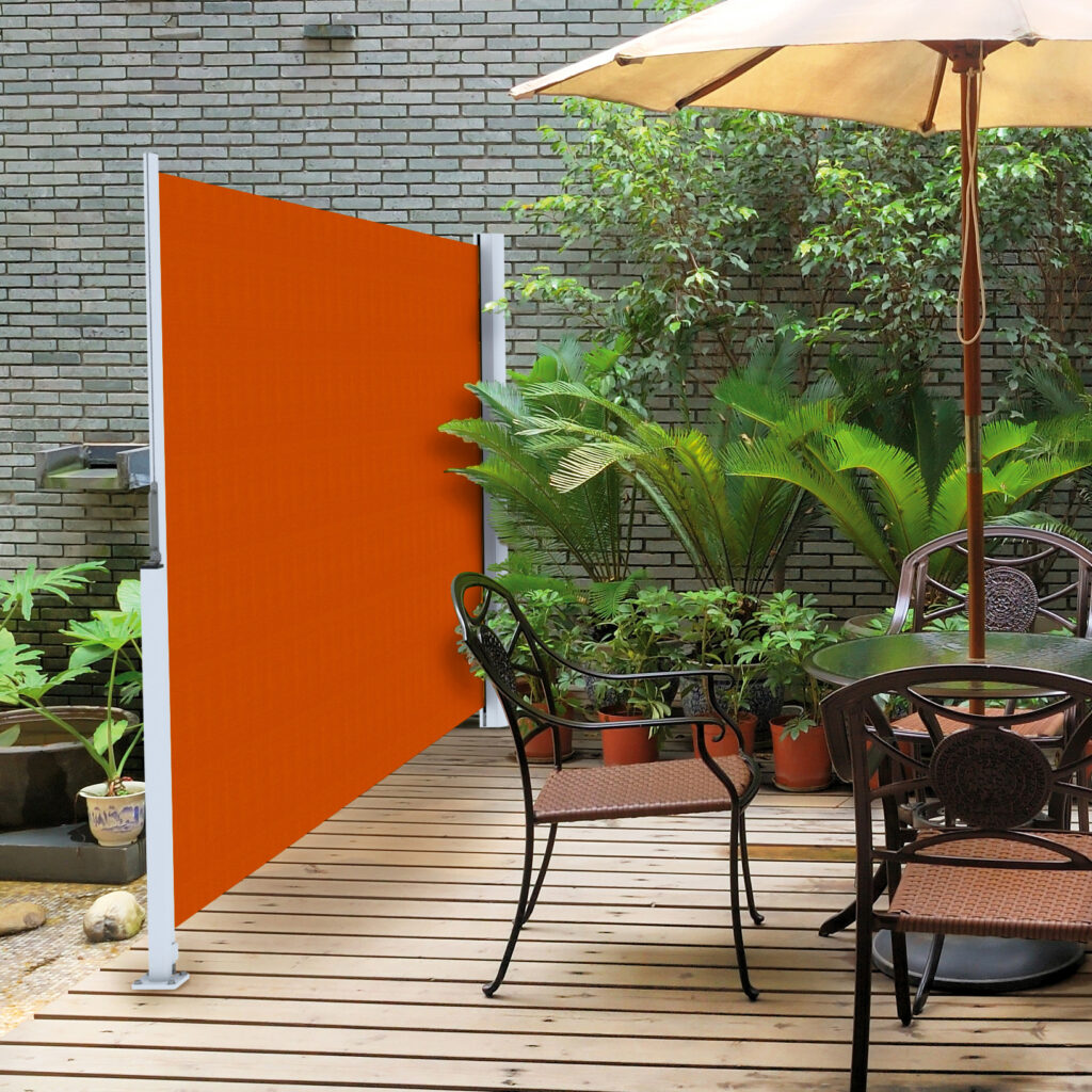 An orange horizontal shade that helps divide the space and create shade and privacy.