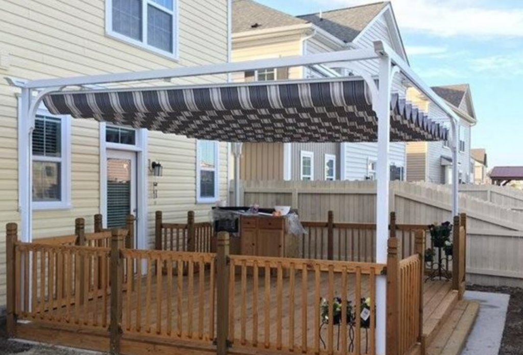 Aristocrat Retractable Canopy covering a backyard porch.